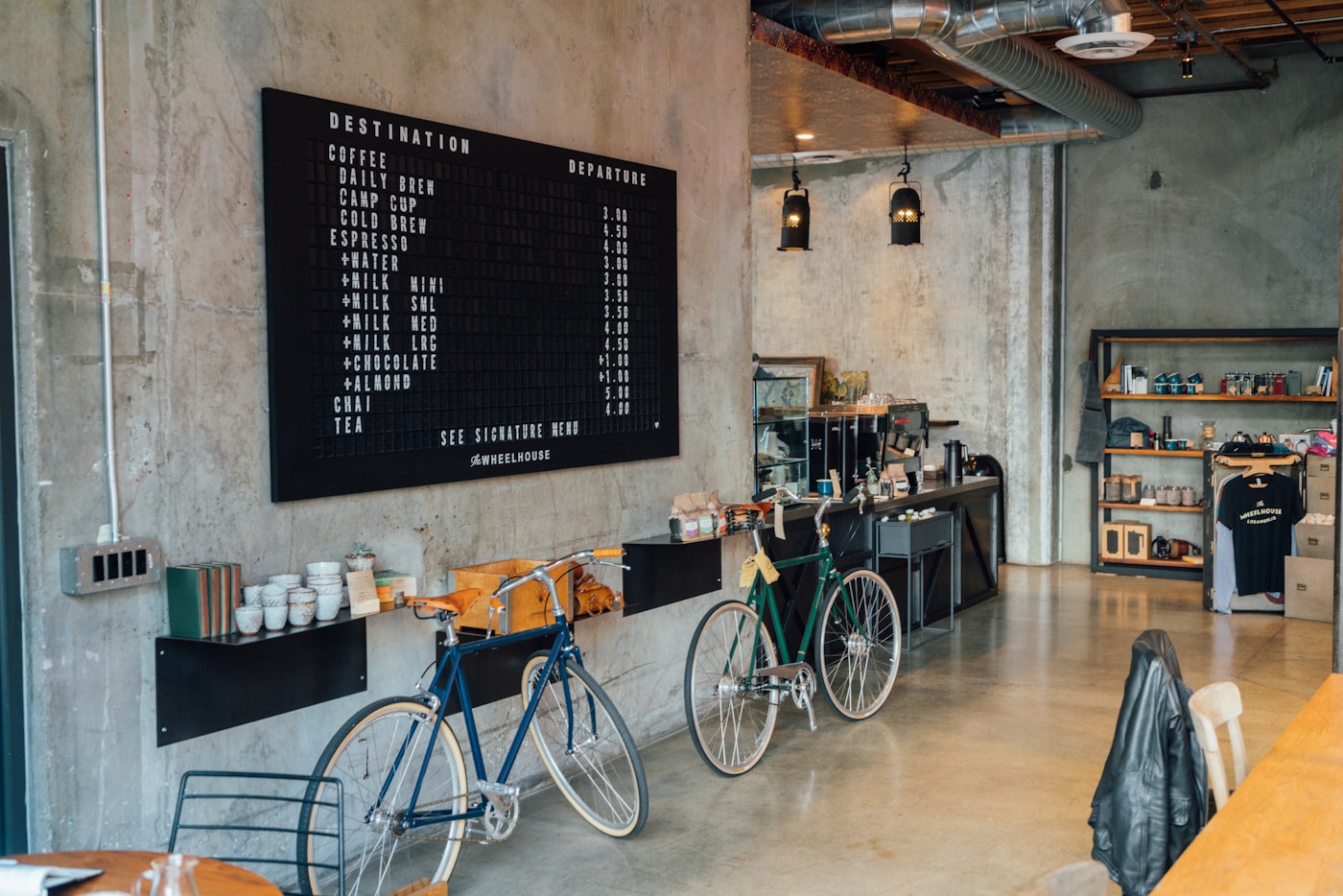 Contemporary coffee bar with bicycles and an open concrete interior